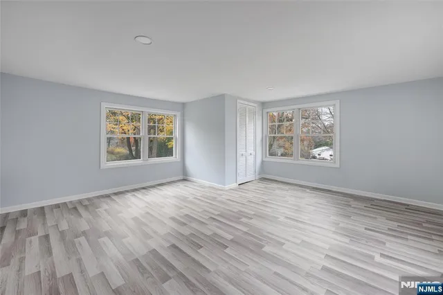 a front view of house with a garden