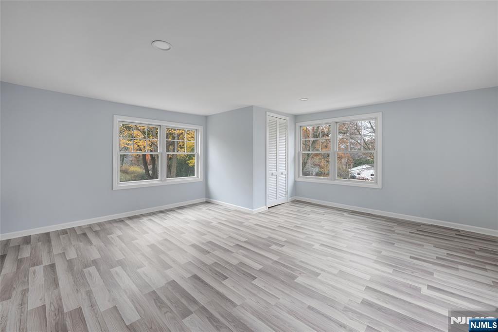 684 Closter Dock Road Closter, NJ 07624 - Photo 26 of 30 wooden floor in an empty room with a window