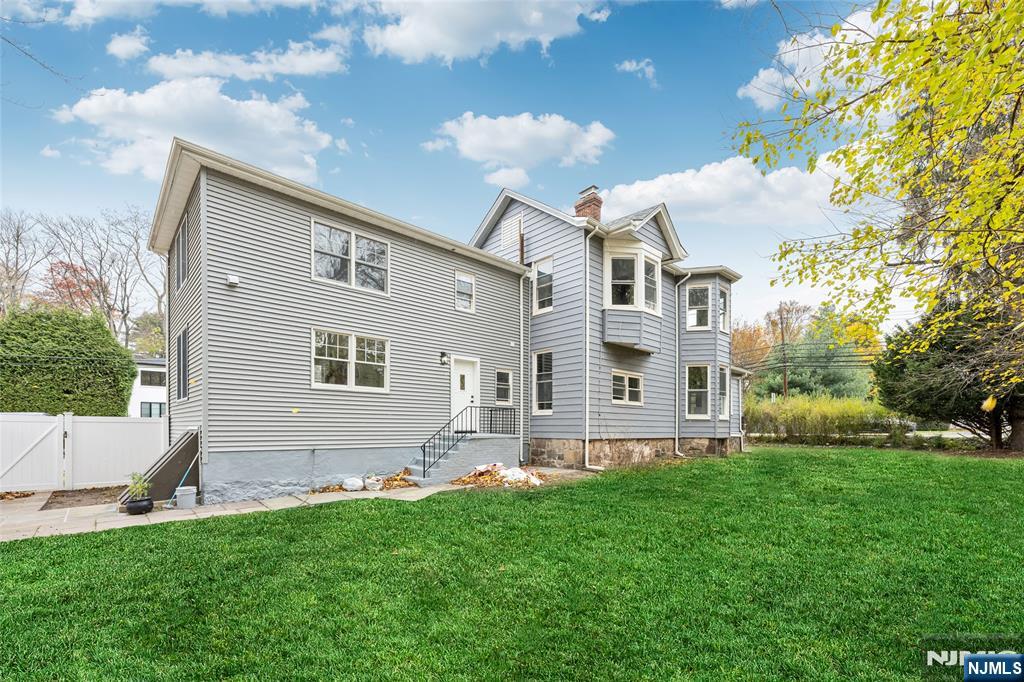 684 Closter Dock Road Closter, NJ 07624 - Photo 28 of 30 a front view of house with yard and green space