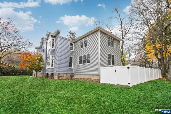 a view of a house with a yard porch and sitting area
