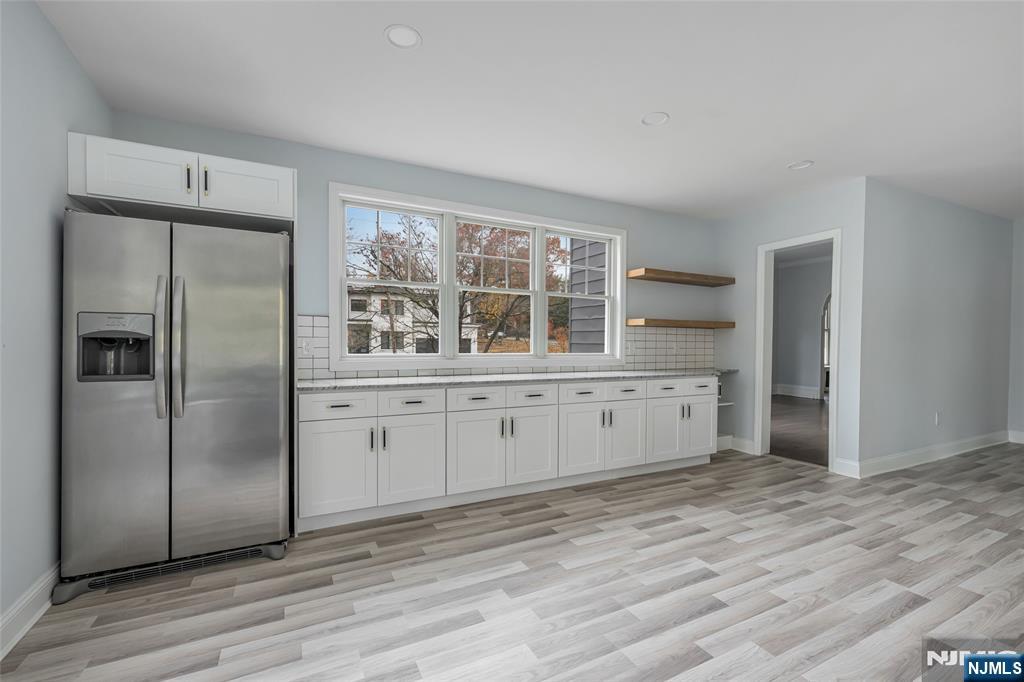 684 Closter Dock Road Closter, NJ 07624 - Photo 9 of 30 a kitchen with stainless steel appliances a refrigerator and more cabinets