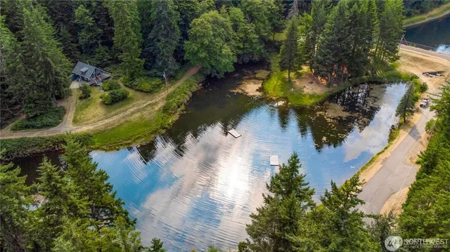 a view of a lake with a yard