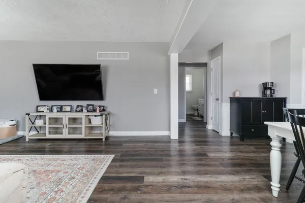 a living room with furniture and flat screen tv