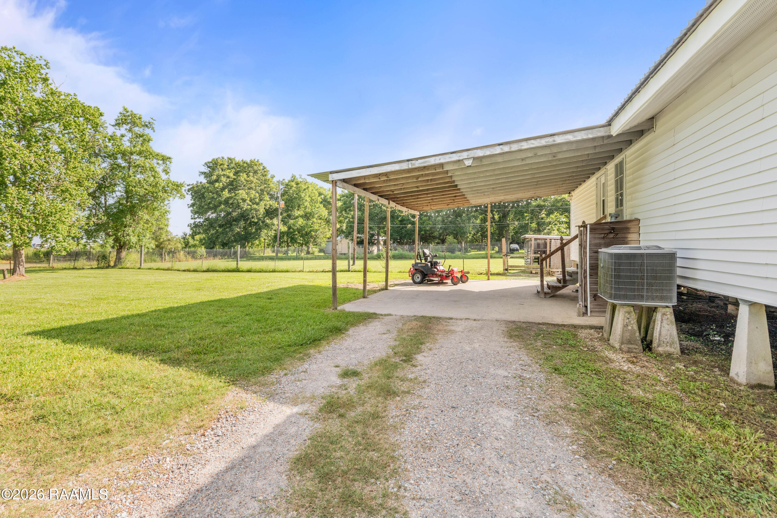 2140 Lucien Road Erath, LA 70533 - Photo 24 of 33 Double Carport to Side Yard