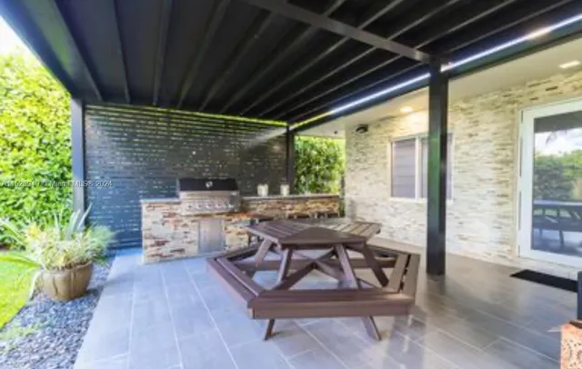 a swimming pool with outdoor seating