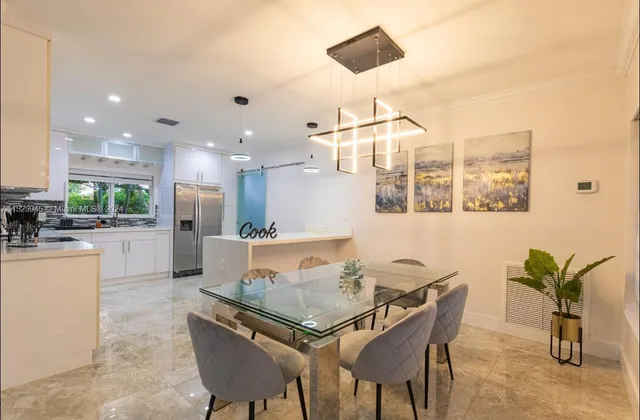 a kitchen with a sink and refrigerator