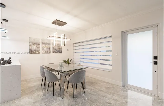 a kitchen with white cabinets and appliances