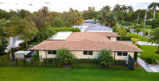 aerial view of a house with a garden