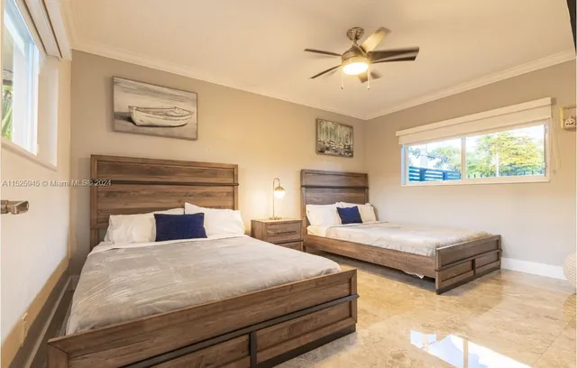 a bed sitting in a room next to a window