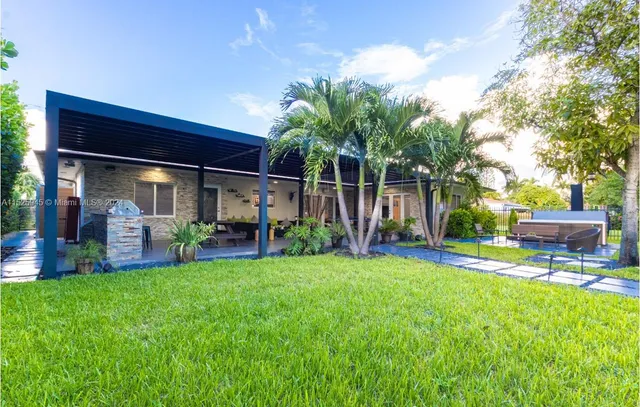 a view of a backyard with a small cabin