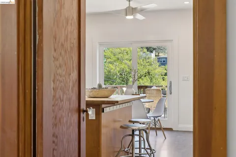 a view of a dining room with furniture window and outside view