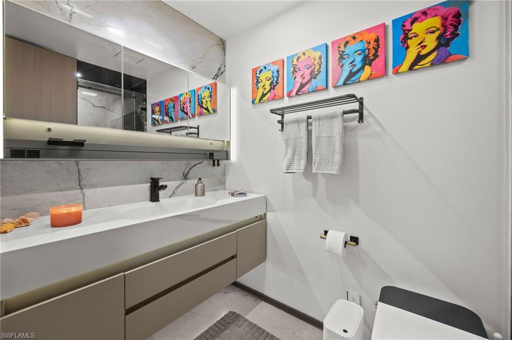 1100 Pine Ridge Road, Unit B103 Naples, FL 34108 - Photo 26 of 38 a utility room with dryer and washer