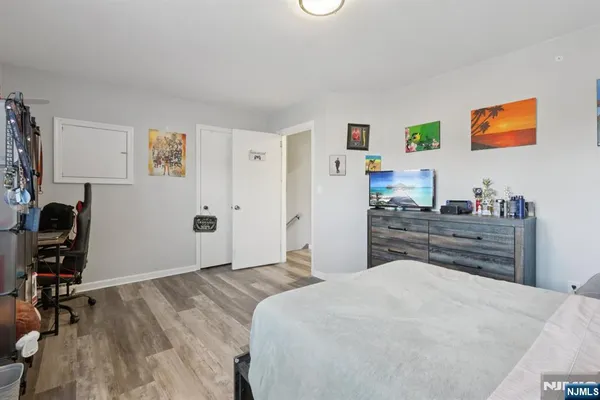 a bedroom with a bed and a desk