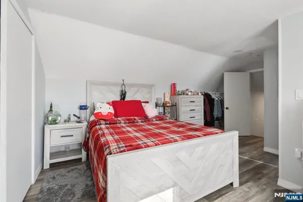 a bed room with a bed and a dresser