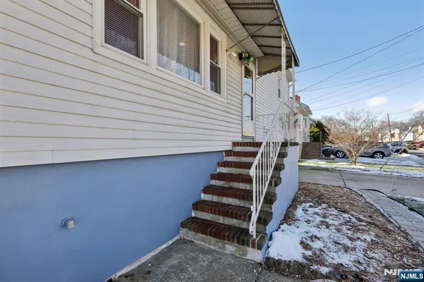 a view of a backyard with stairs and wooden floor