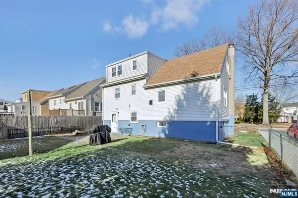 a view of a house with a back yard