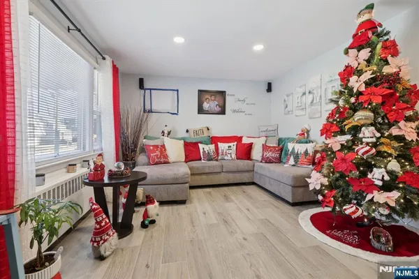 a living room with furniture and flowers