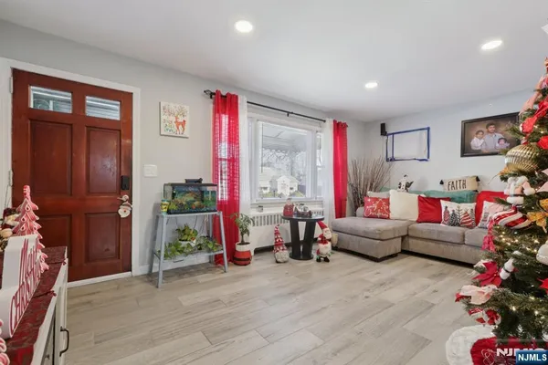 a living room with furniture and a floor to ceiling window