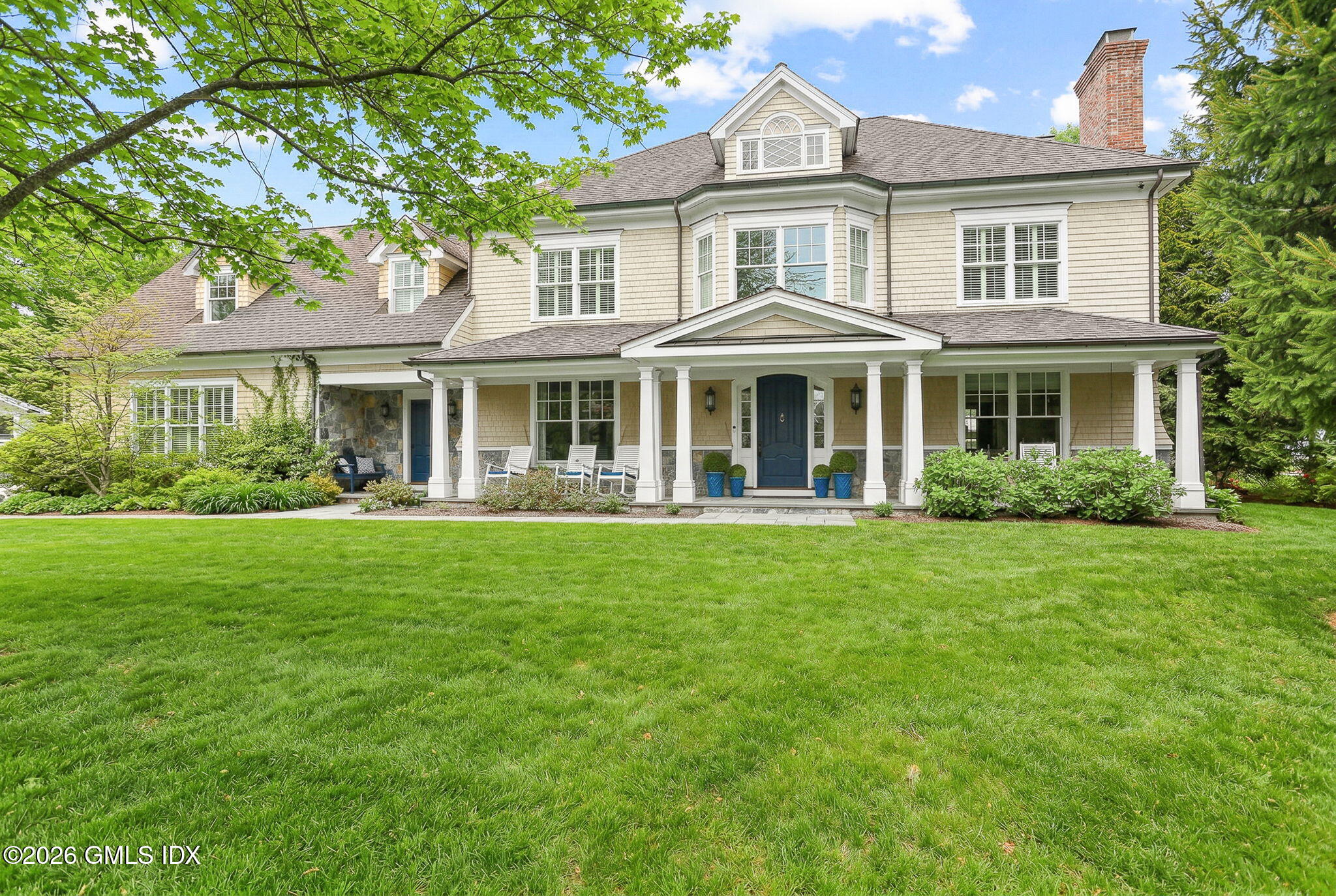 1 Bramble Lane Riverside, CT 06878 - Photo 1 of 42 a front view of a house with a garden