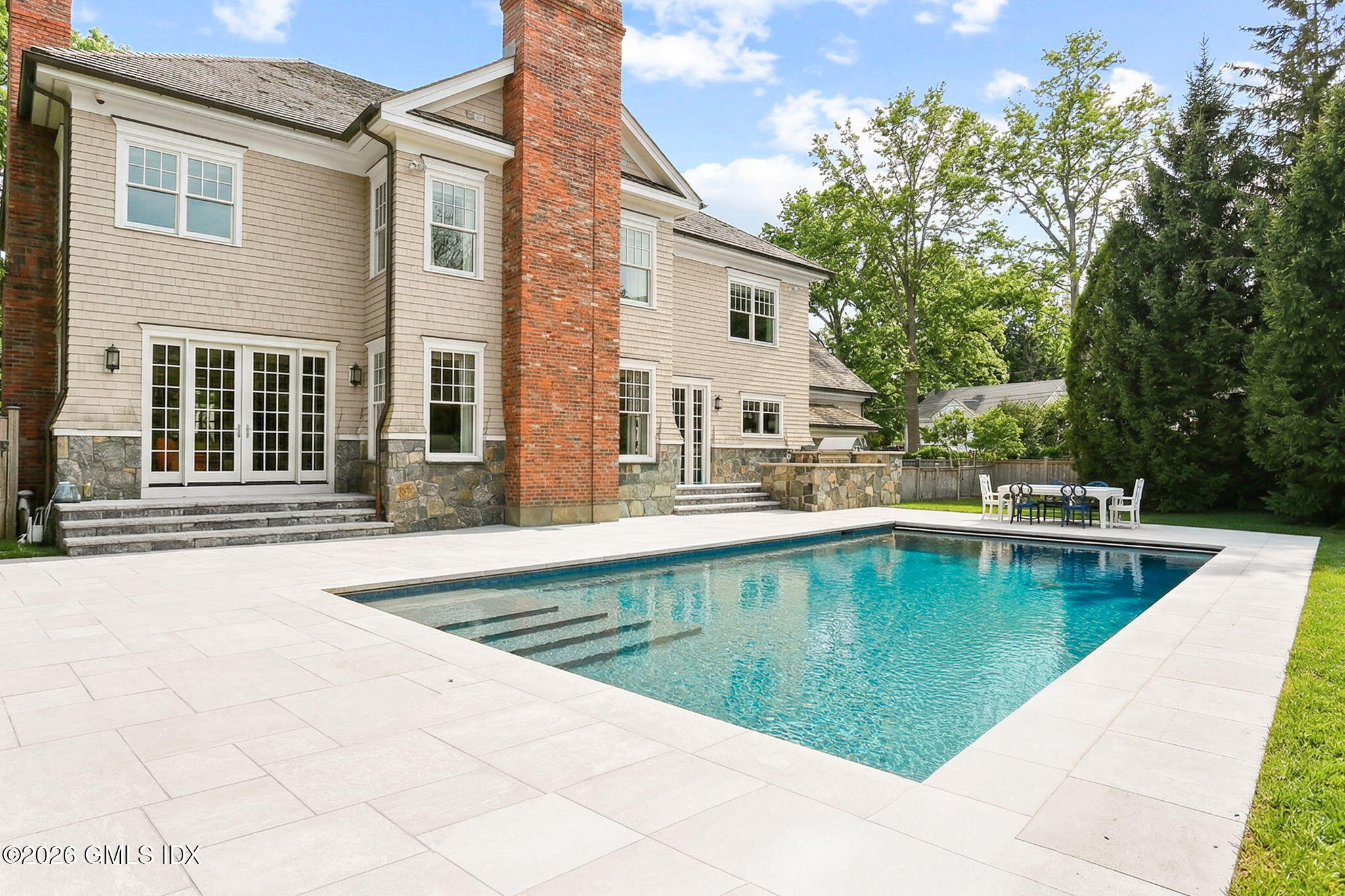 1 Bramble Lane Riverside, CT 06878 - Photo 2 of 42 a view of a house with swimming pool