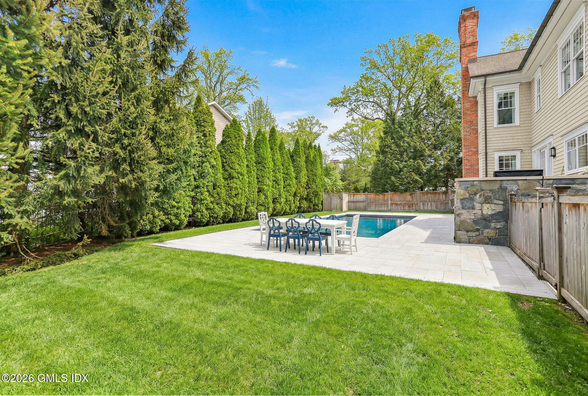 1 Bramble Lane Riverside, CT 06878 - Photo 3 of 42 a view of backyard with swimming pool and patio