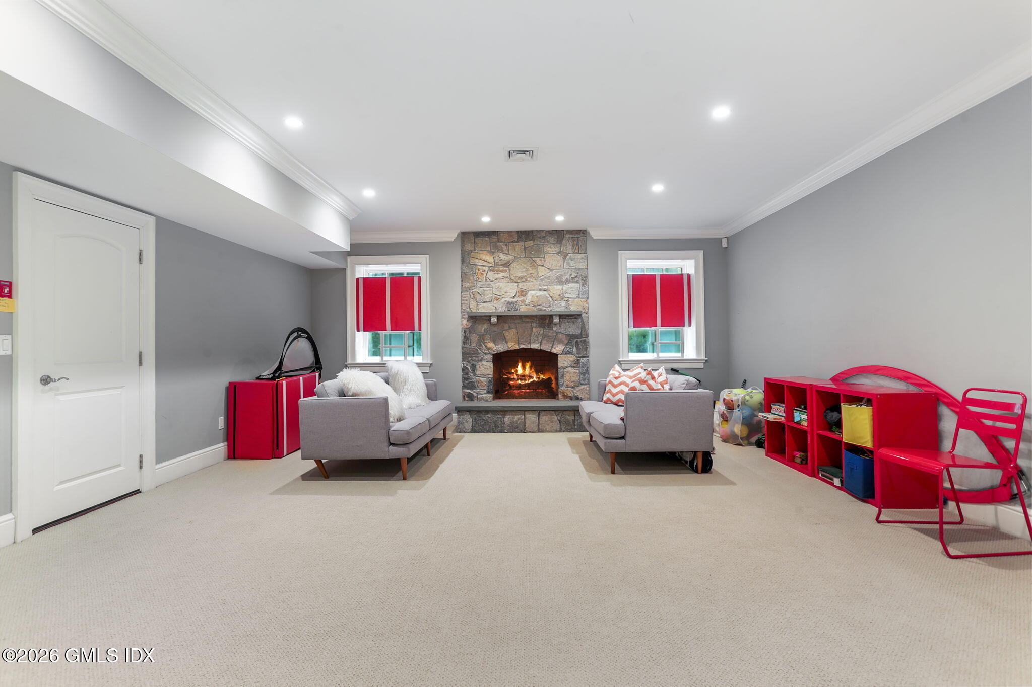 1 Bramble Lane Riverside, CT 06878 - Photo 31 of 42 a living room with furniture gym equipment and a fireplace