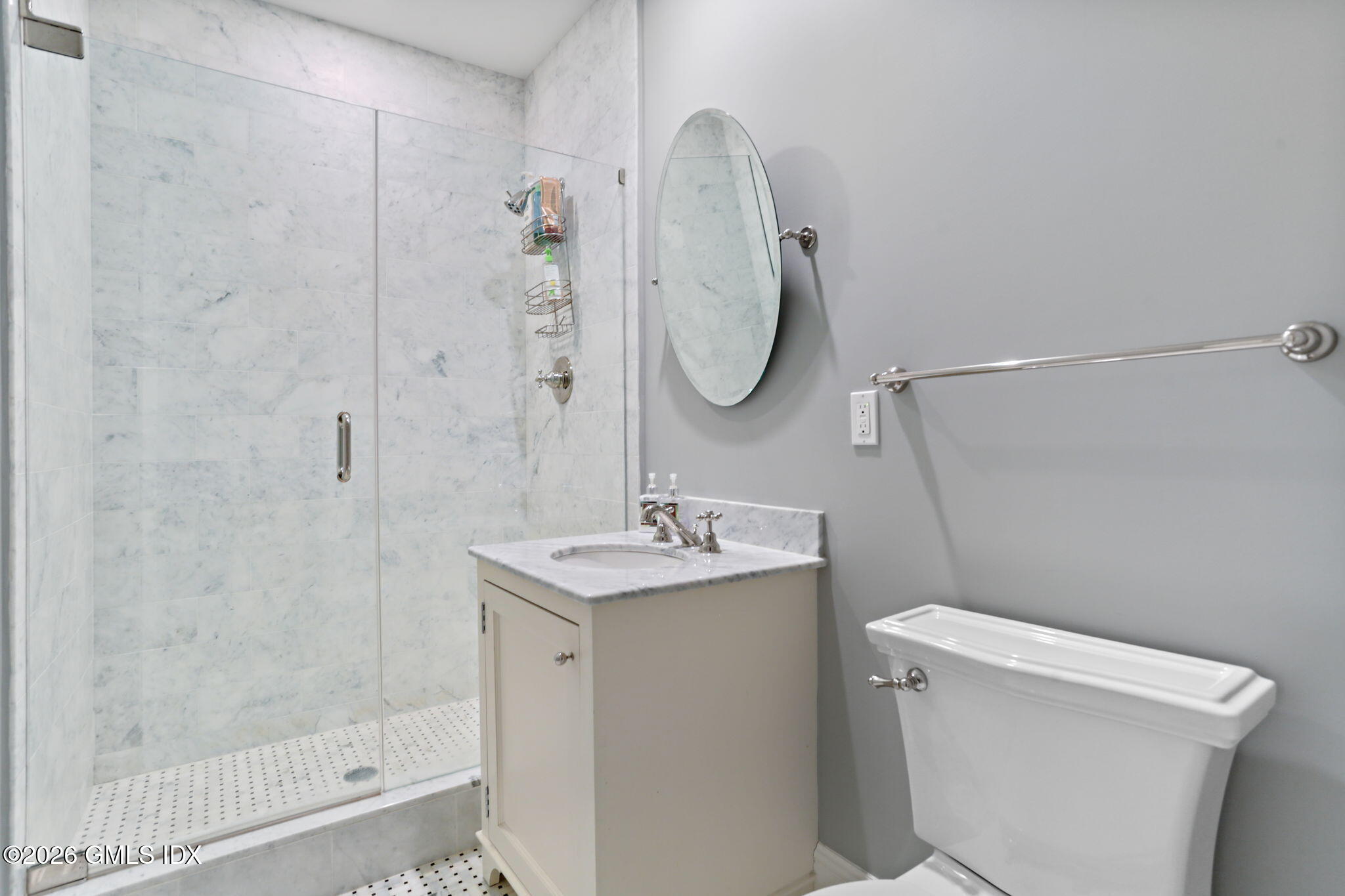 1 Bramble Lane Riverside, CT 06878 - Photo 32 of 42 a bathroom with a sink a toilet and a mirror