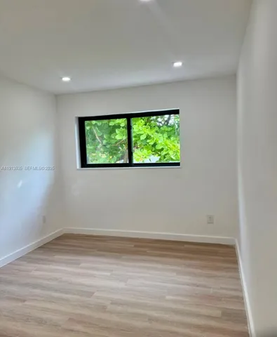 a view of a room has a window
