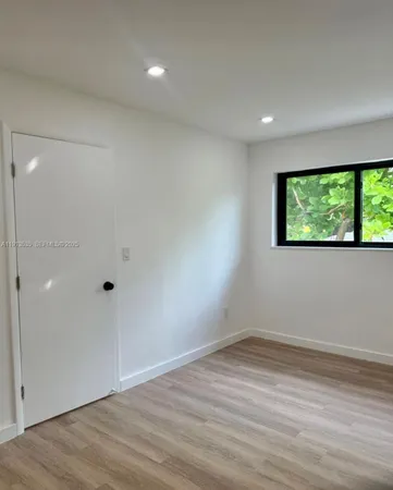 a view of a room has a window
