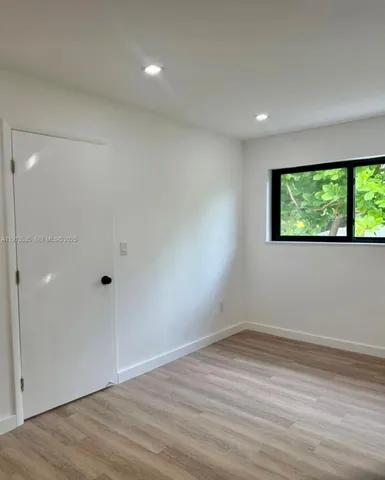 a view of a room has a window