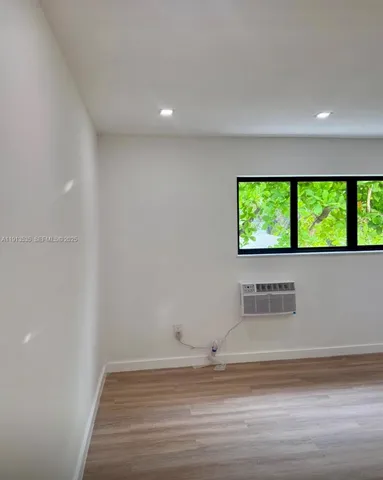 a view of a kitchen with wooden floor