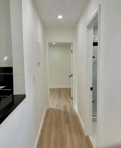 a bathroom with a toilet a sink and shower