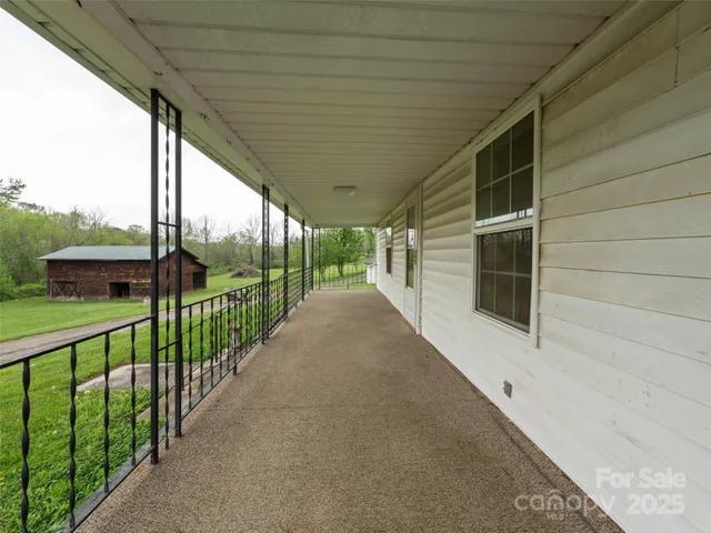 an aerial view of a house with big yard