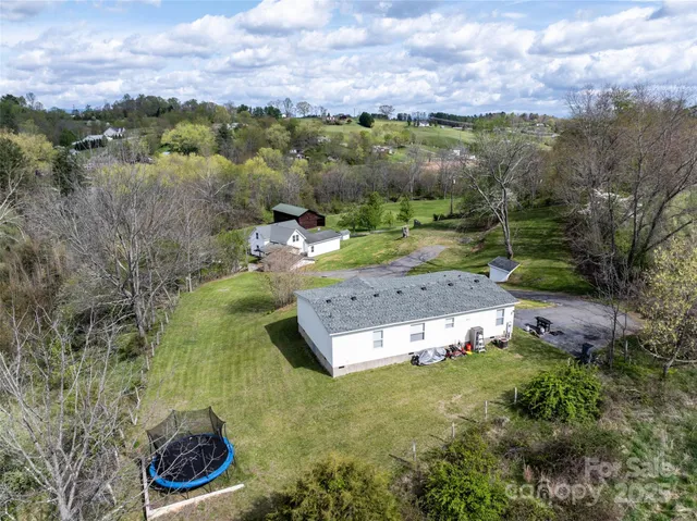 a view of a trees with a yard