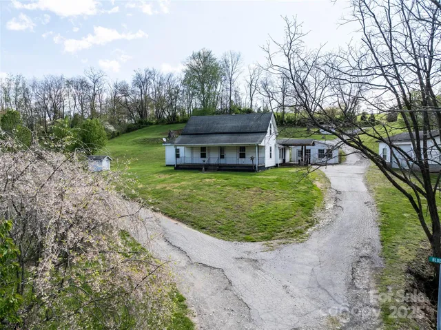 a view of a swimming pool with a yard