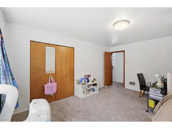 a bedroom with a bed and furniture