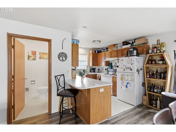 a kitchen with a sink cabinets and window