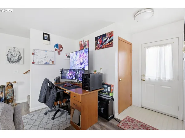 a bedroom with a bed and a desk