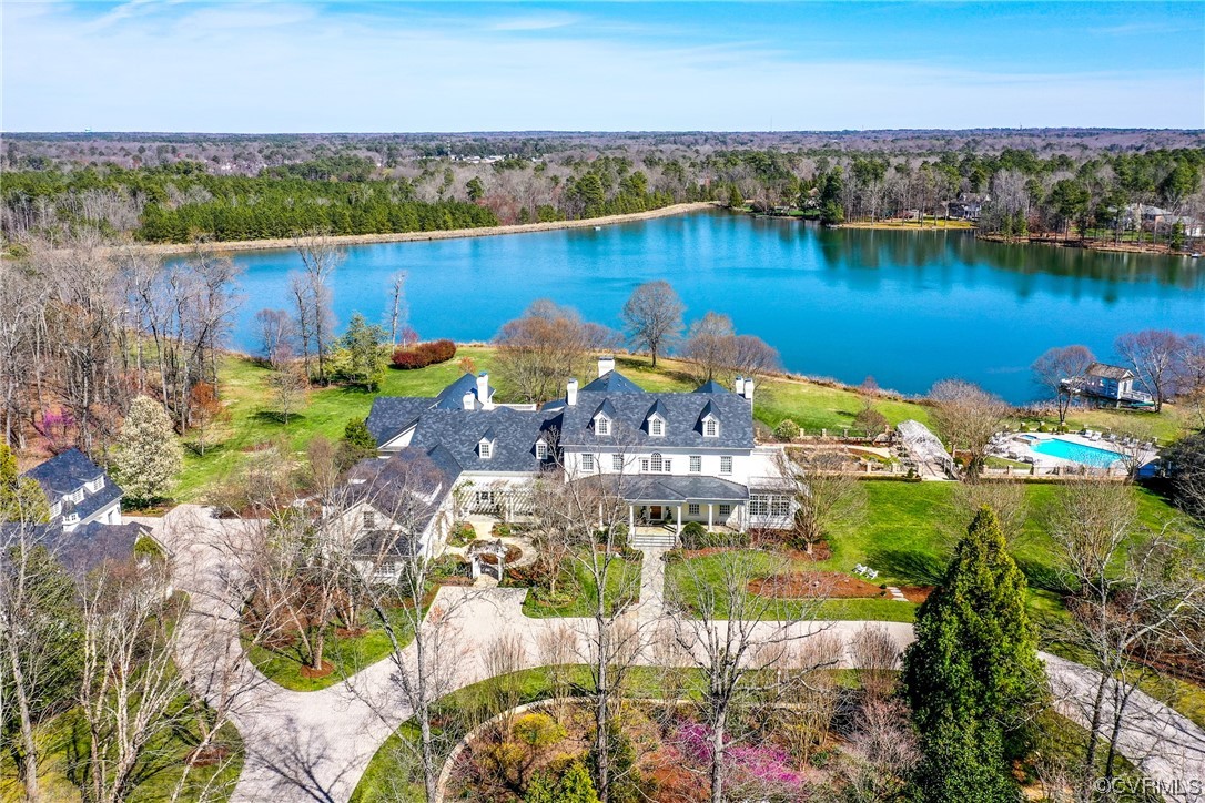 an aerial view of a house with a lake view
