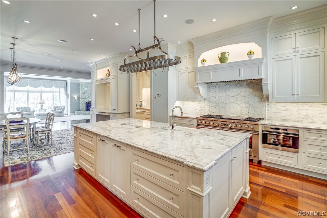 501 Rivergate Drive Henrico, VA 23238 - Photo 12 of 50 a kitchen with stainless steel appliances granite countertop a stove a sink and a wooden cabinets