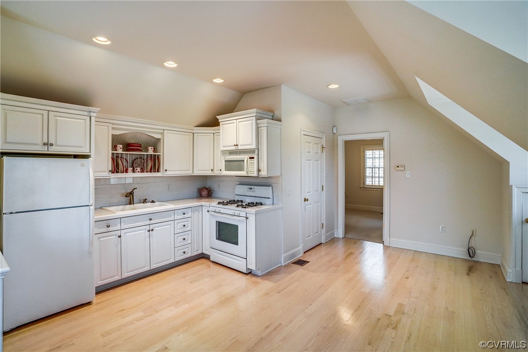 501 Rivergate Drive Henrico, VA 23238 - Photo 37 of 50 a kitchen with granite countertop white cabinets and white appliances
