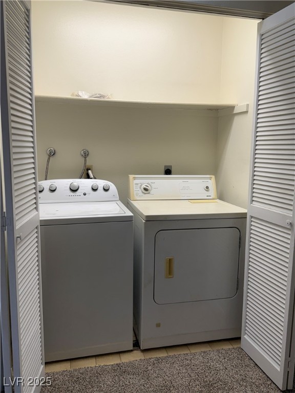 3367 Reka Street Las Vegas, NV 89121 - Photo 17 of 38 Laundry room featuring light tile patterned floors and washing machine and clothes dryer