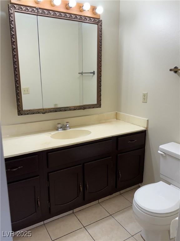 3367 Reka Street Las Vegas, NV 89121 - Photo 21 of 38 Half bath featuring light tile patterned floors and vanity