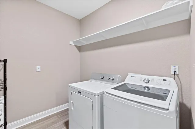 a utility room with dryer and washer