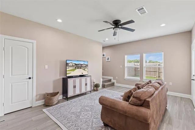 a living room with furniture and a window