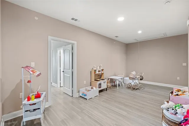 a living room with furniture and toys