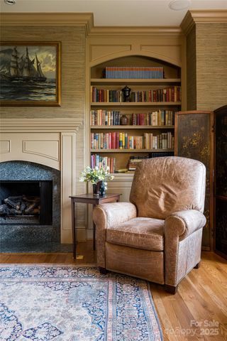 a living room with a couch and a fireplace