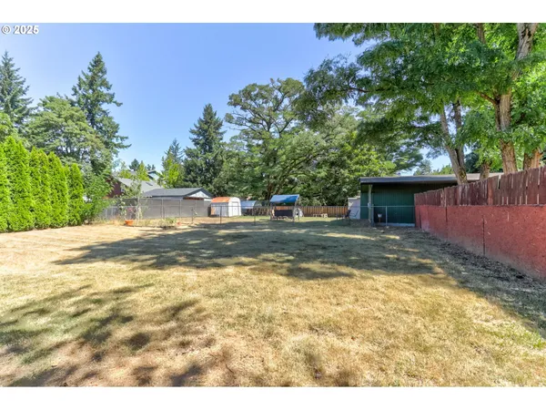 a view of a yard with swimming pool