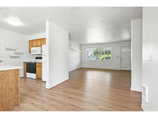 a view interior of a house kitchen and wooden floor