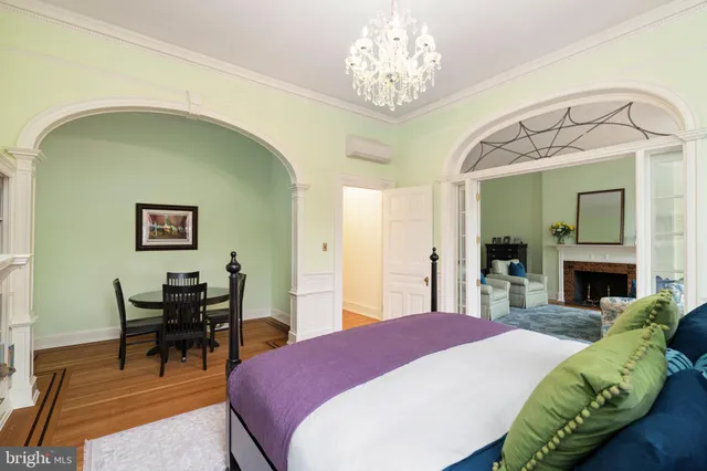 a dining room with furniture and a chandelier